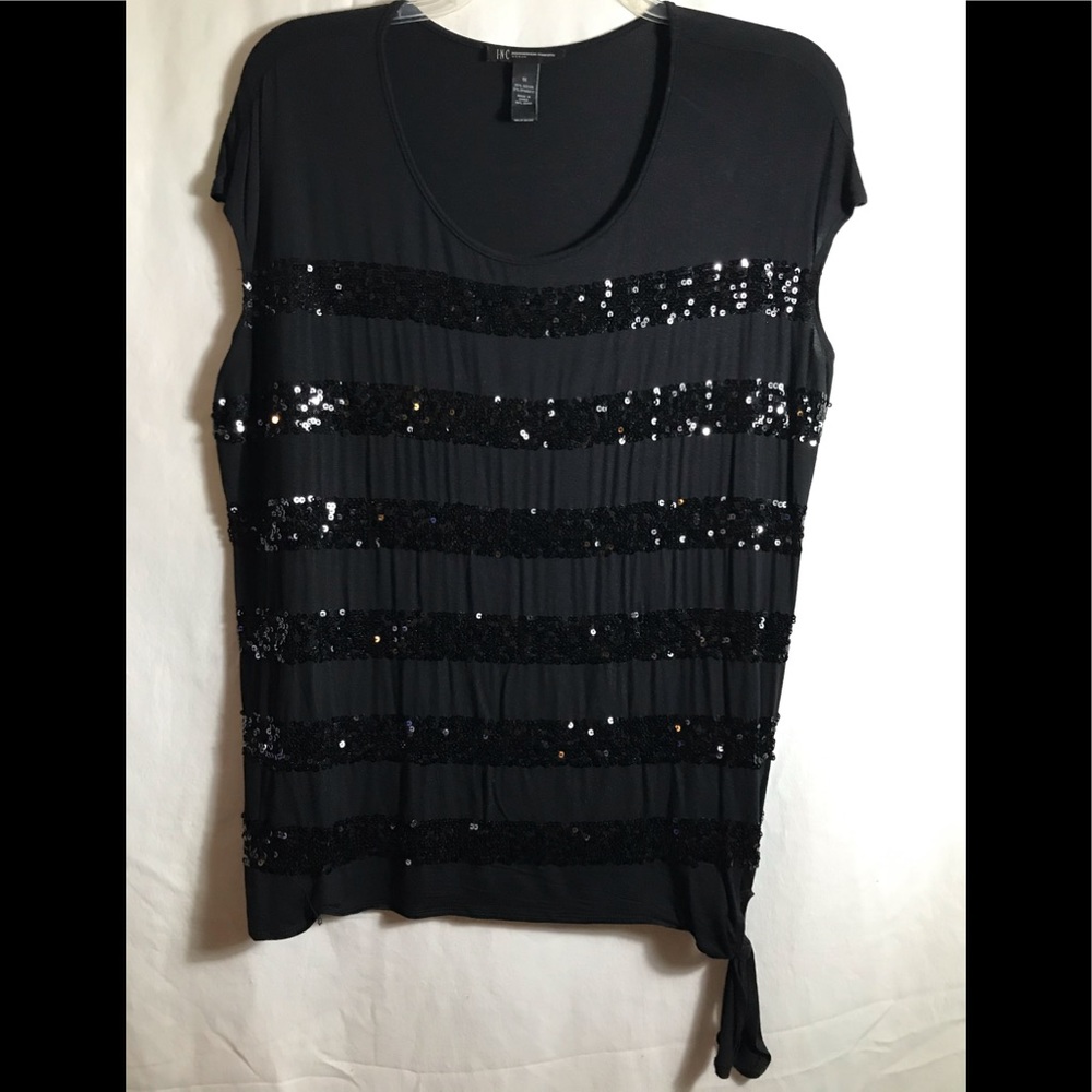 Black sequin-striped top with hip tie.